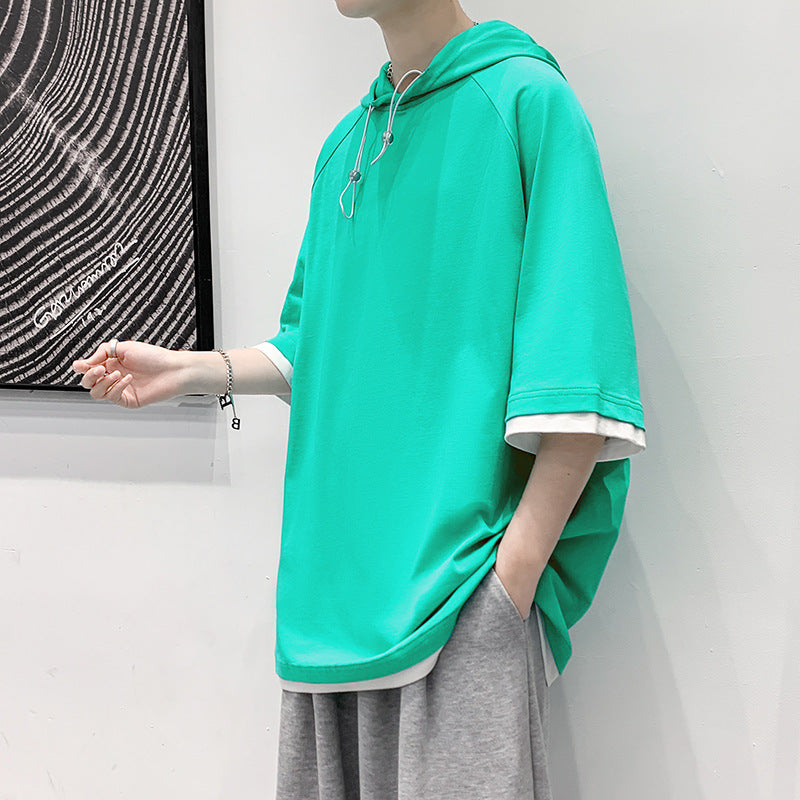 Herren oversize T-shirt med huva och ventilerande egenskaper Mirla-Eva Jonsson