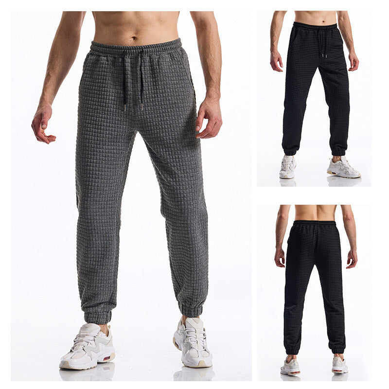 Herrens avslappnade joggingsbyxor i andningsbart material med elastisk midja och praktisk fickdesign Mirla-Eva Jonsson