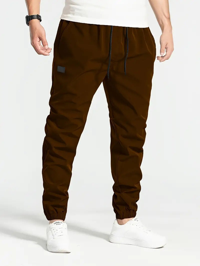 Herrens casual joggingbyxor med elastisk midja och praktiska sidofickor Mirla-Eva Jonsson