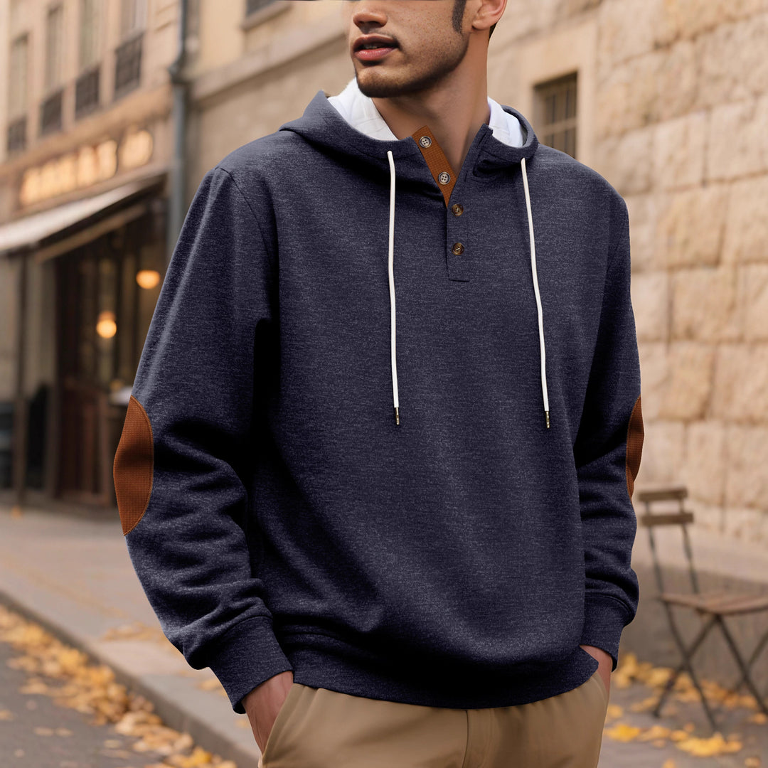 Herrens hoodie med modeknappslå och strukturerad design Mirla-Eva Jonsson