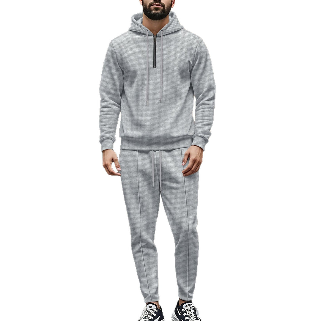 Herrens modiskt fritidsset med avslappnad hoodie och elegant joggingsbyxa Mirla-Eva Jonsson