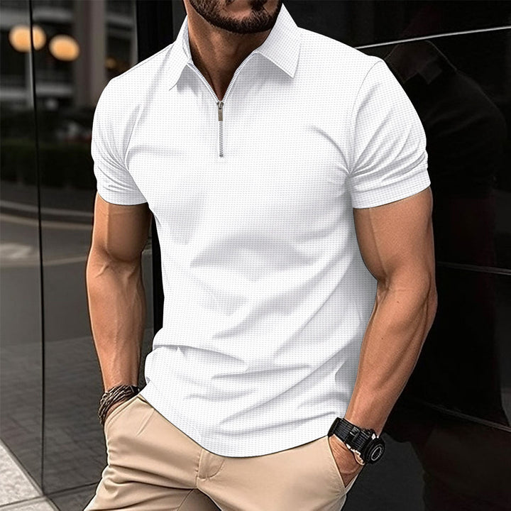 Herrkortärmad poloshirt med dragkedja och strukturerad design Mirla-Eva Jonsson