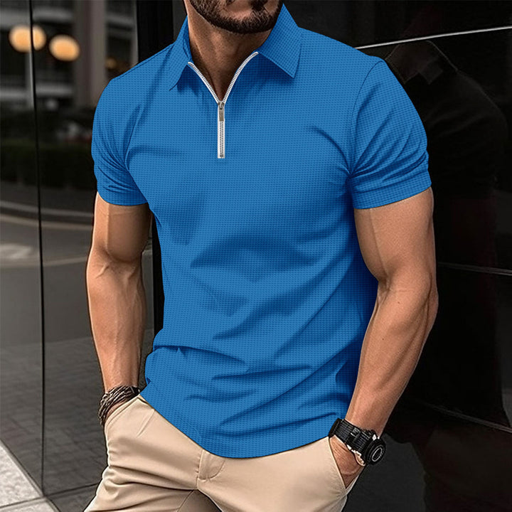Herrkortärmad poloshirt med dragkedja och strukturerad design Mirla-Eva Jonsson