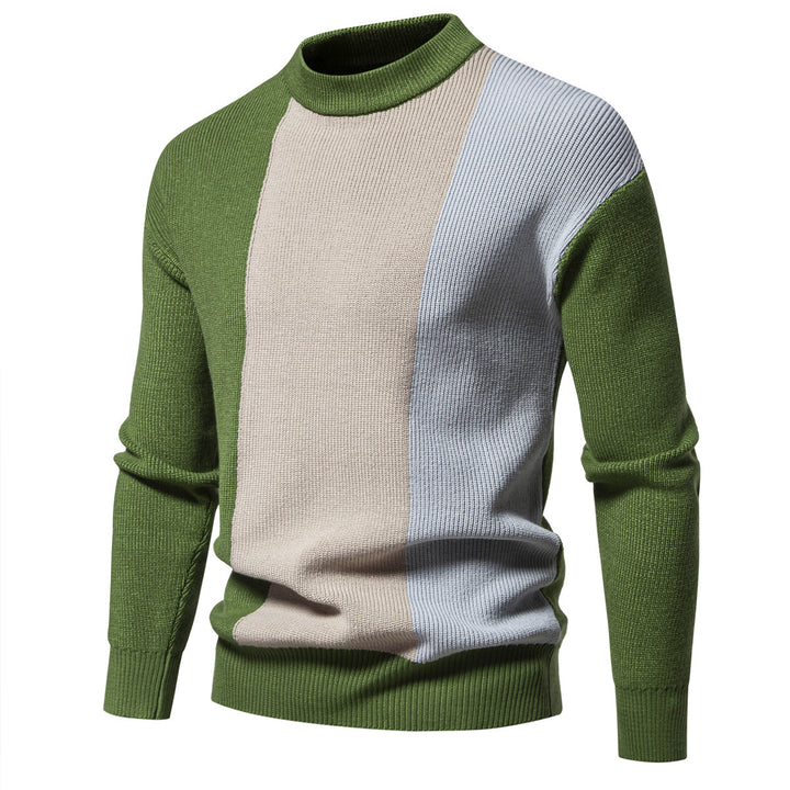 Herrstickad tröja med modernt färgblockdesign och hög krage Mirla-Eva Jonsson