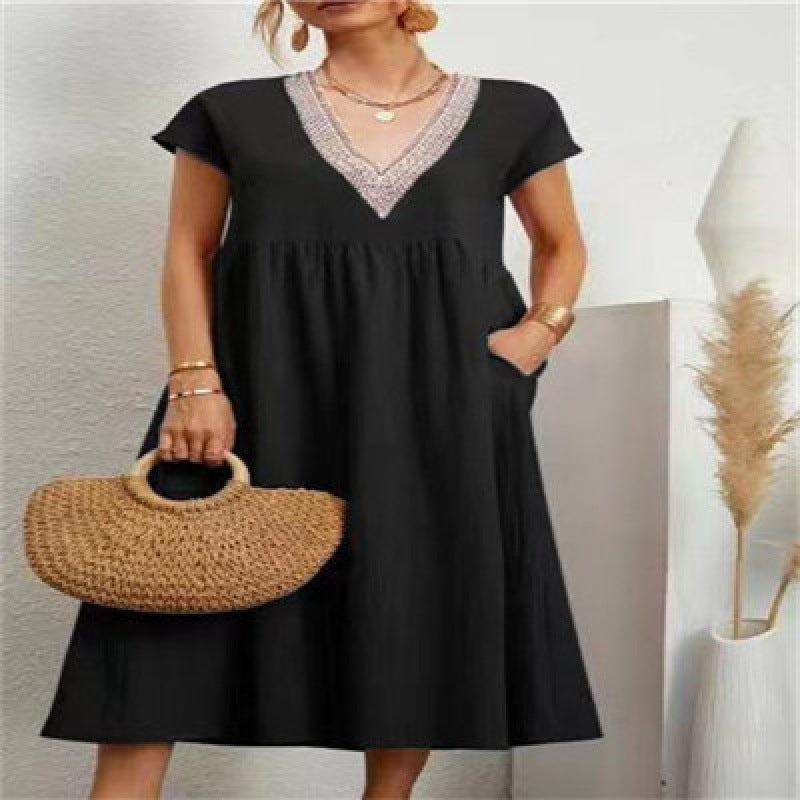 Kvinna maxi dress med elegant V-hals och sidofickor Mirla-Eva Jonsson