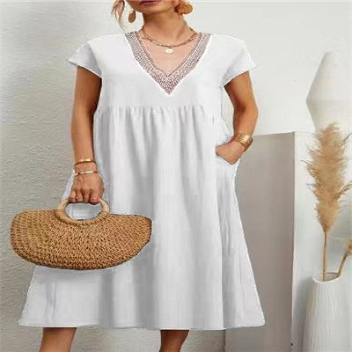 Kvinna maxi dress med elegant V-hals och sidofickor Mirla-Eva Jonsson