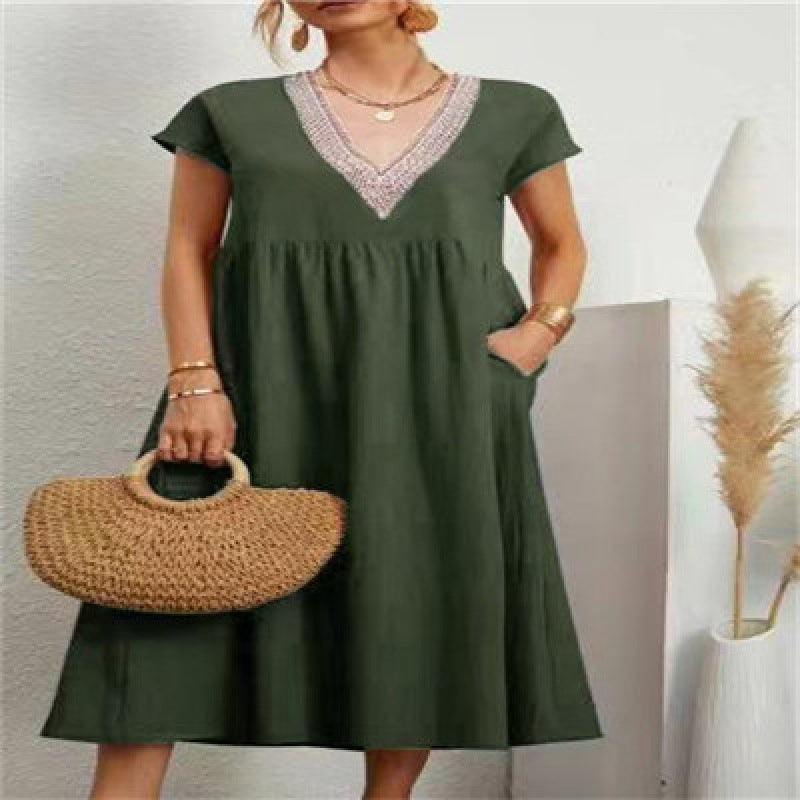 Kvinna maxi dress med elegant V-hals och sidofickor Mirla-Eva Jonsson