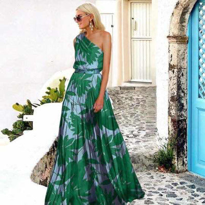Kvinna maxi klänning med asymmetrisk topp och blommönster-Eva Jonsson