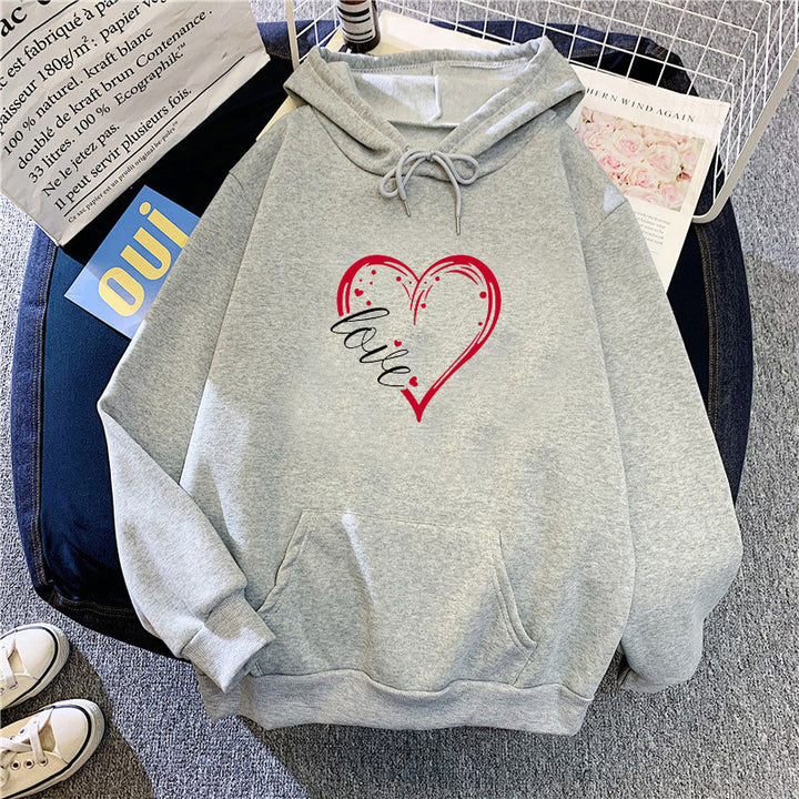 Kvinnas hoodie med kreativ hjärttryck och mjukt innerfoder Mirla-Eva Jonsson