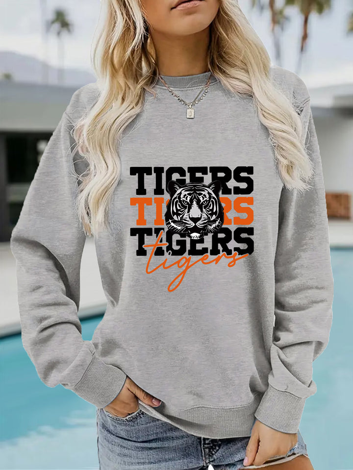 Kvinnas sweatshirt med djurisk tigerdesign och avslappnad passform Mirla-Eva Jonsson