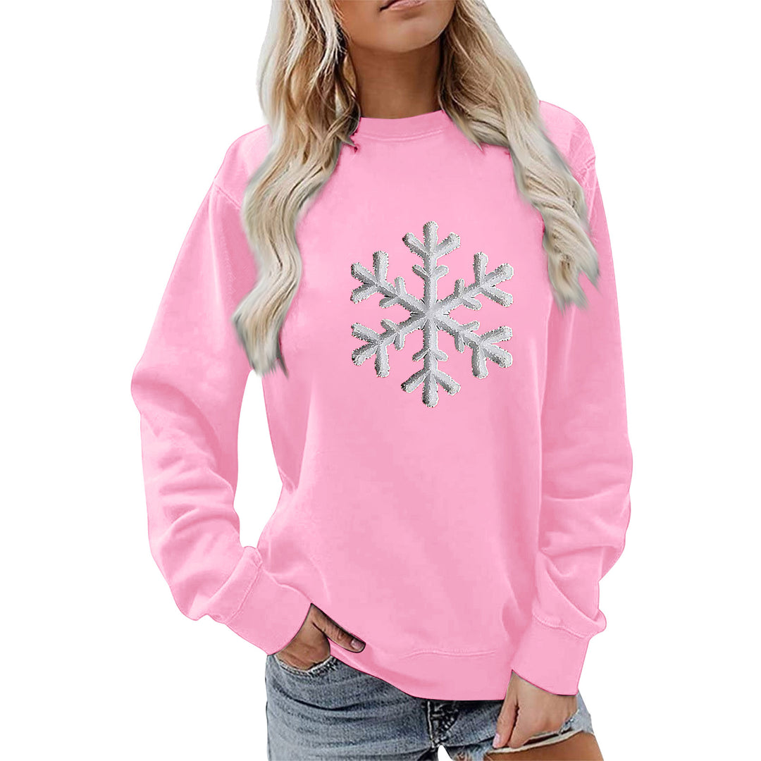 Kvinnas sweatshirt med glittrande snöflinge design och avslappnad passform Mirla-Eva Jonsson