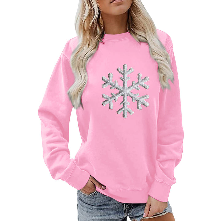 Kvinnas sweatshirt med glittrande snöflinge design och avslappnad passform Mirla-Eva Jonsson