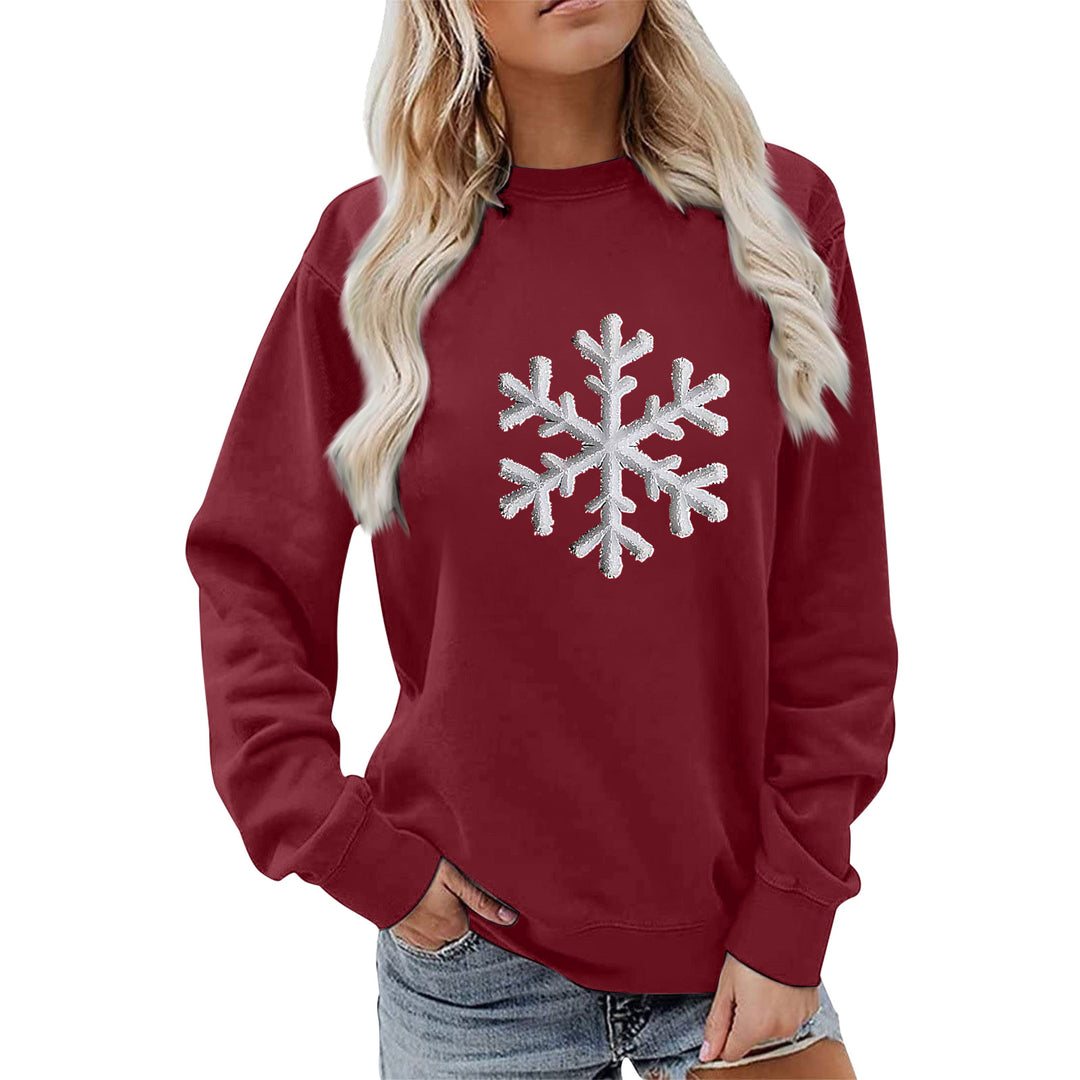Kvinnas sweatshirt med glittrande snöflinge design och avslappnad passform Mirla-Eva Jonsson