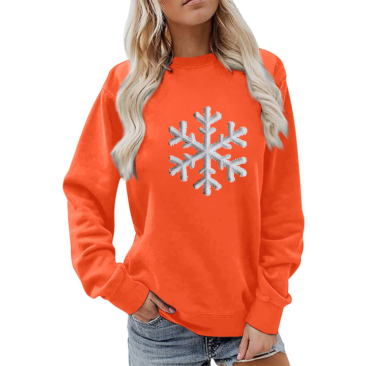 Kvinnas sweatshirt med glittrande snöflinge design och avslappnad passform Mirla-Eva Jonsson