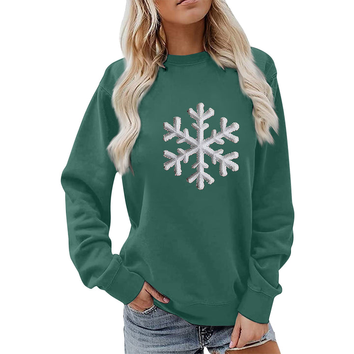 Kvinnas sweatshirt med glittrande snöflinge design och avslappnad passform Mirla-Eva Jonsson