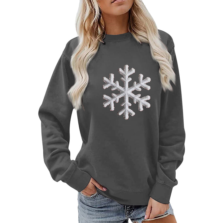 Kvinnas sweatshirt med glittrande snöflinge design och avslappnad passform Mirla-Eva Jonsson