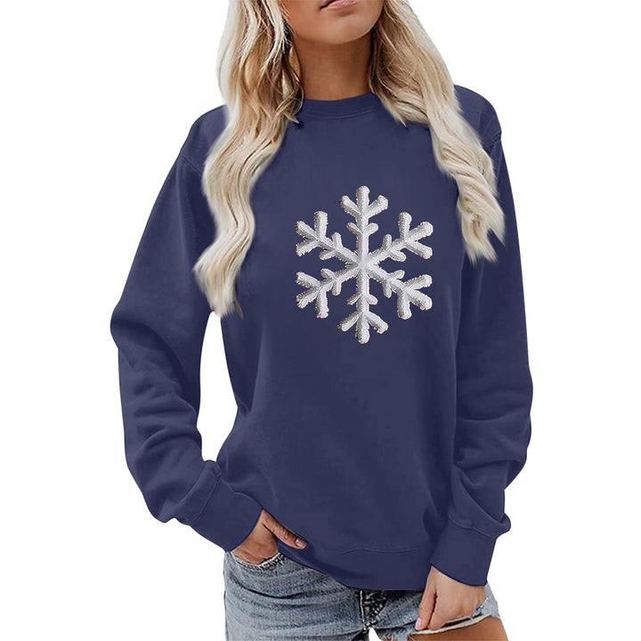 Kvinnas sweatshirt med glittrande snöflinge design och avslappnad passform Mirla-Eva Jonsson
