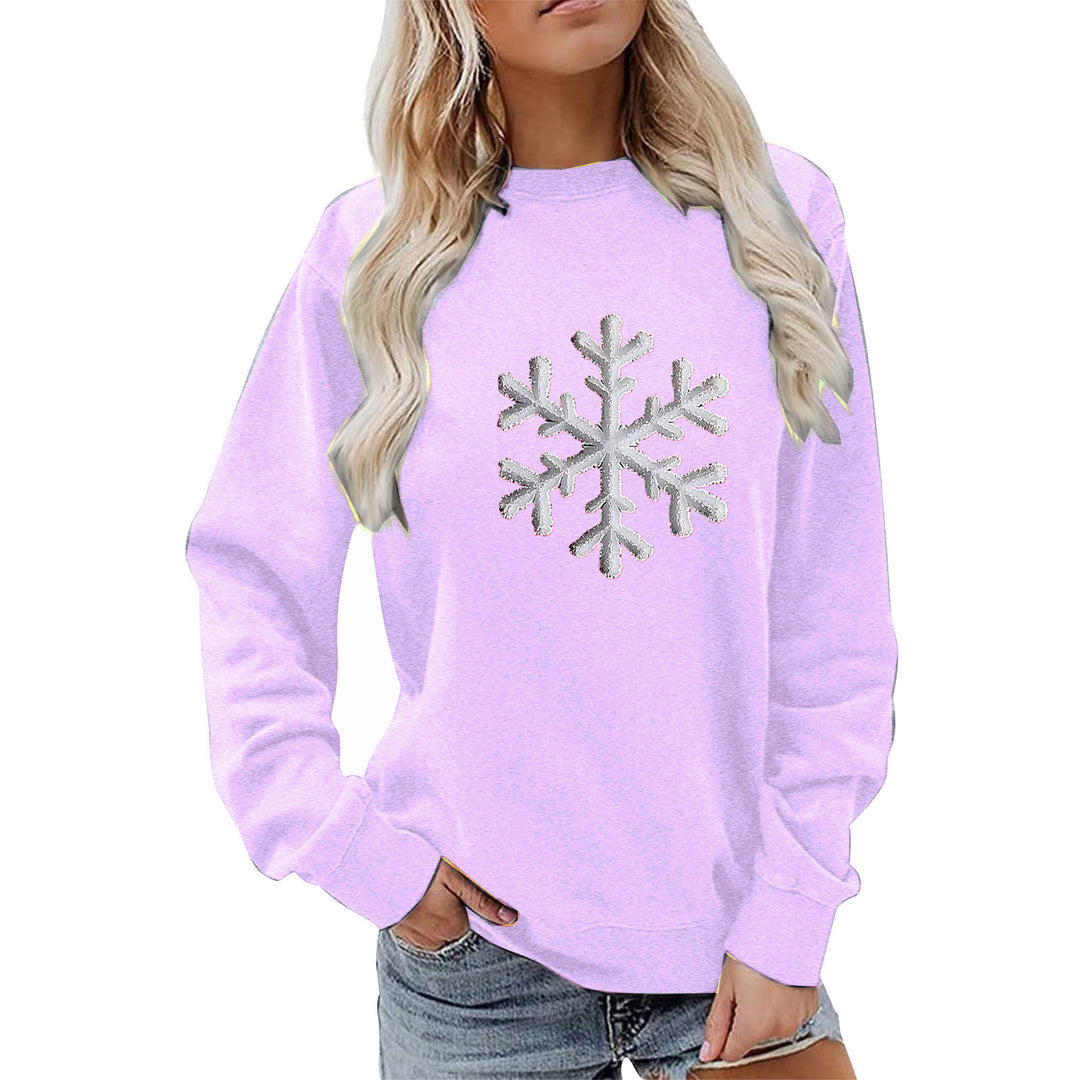 Kvinnas sweatshirt med glittrande snöflinge design och avslappnad passform Mirla-Eva Jonsson