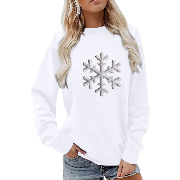 Kvinnas sweatshirt med glittrande snöflinge design och avslappnad passform Mirla-Eva Jonsson