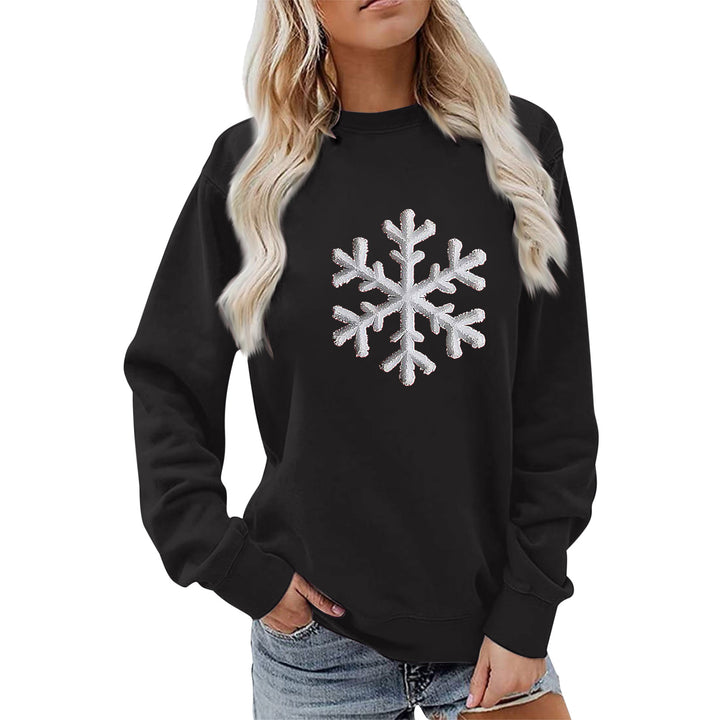Kvinnas sweatshirt med glittrande snöflinge design och avslappnad passform Mirla-Eva Jonsson