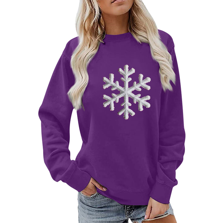Kvinnas sweatshirt med glittrande snöflinge design och avslappnad passform Mirla-Eva Jonsson