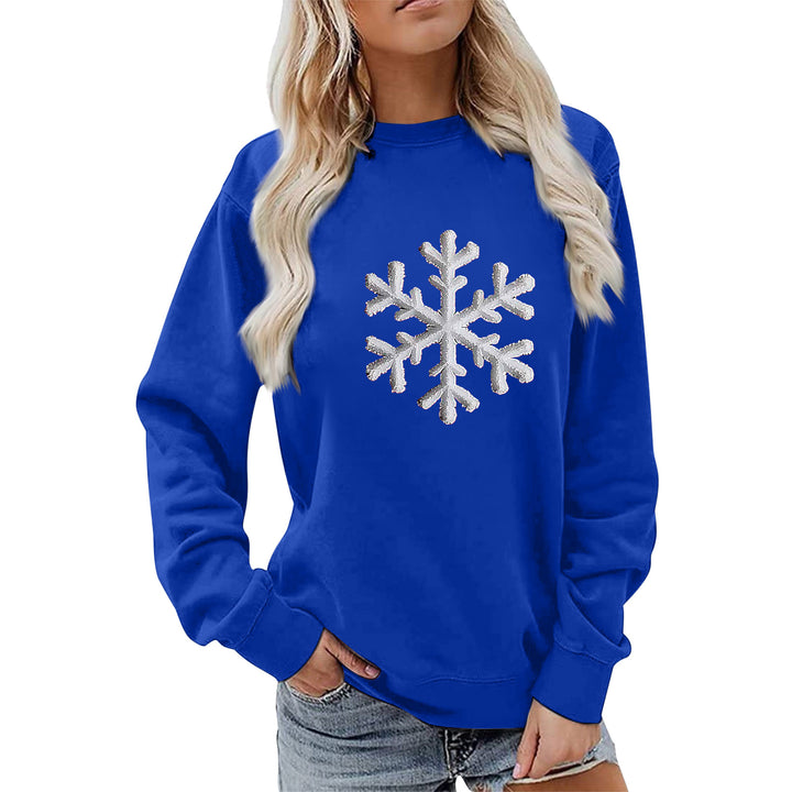 Kvinnas sweatshirt med glittrande snöflinge design och avslappnad passform Mirla-Eva Jonsson