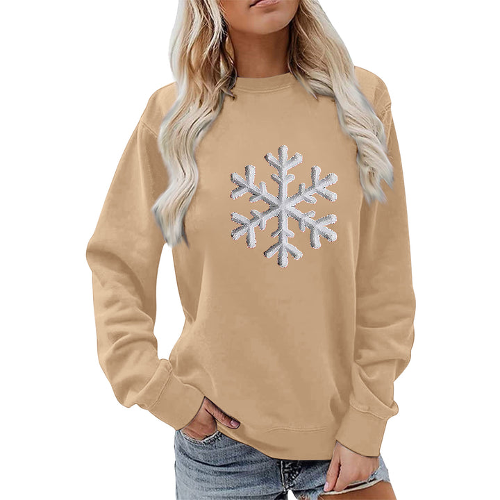 Kvinnas sweatshirt med glittrande snöflinge design och avslappnad passform Mirla-Eva Jonsson