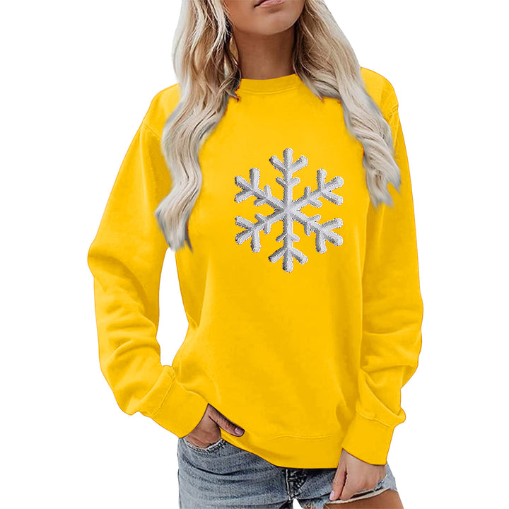 Kvinnas sweatshirt med glittrande snöflinge design och avslappnad passform Mirla-Eva Jonsson