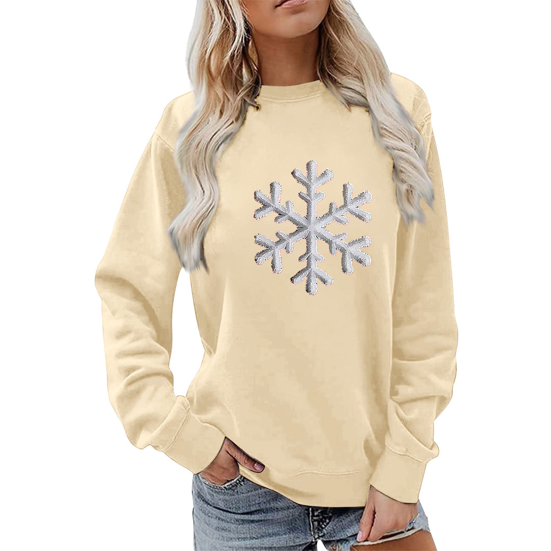Kvinnas sweatshirt med glittrande snöflinge design och avslappnad passform Mirla-Eva Jonsson