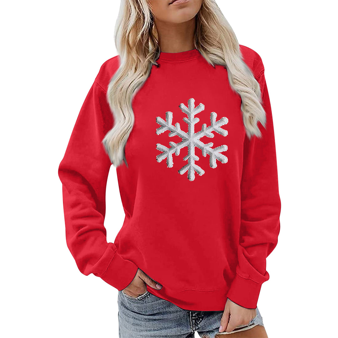 Kvinnas sweatshirt med glittrande snöflinge design och avslappnad passform Mirla-Eva Jonsson