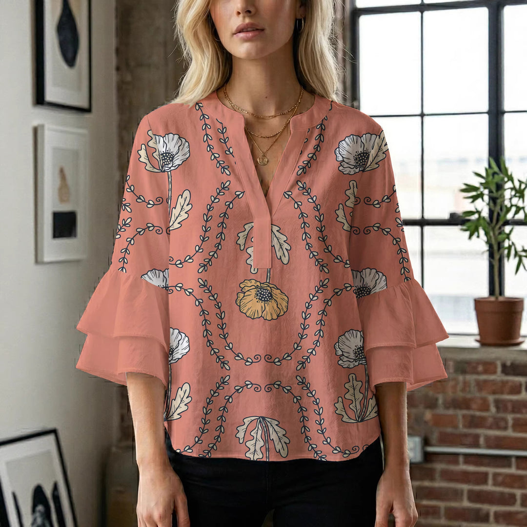 Kvinnblus med voluminösa rynkade ärmar och kreativt blommönster Mirla-Eva Jonsson