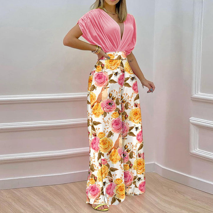 Kvinno Elegant Jumpsuit med Djup V-Hals och Bred Klipp Ben Mirla-Eva Jonsson