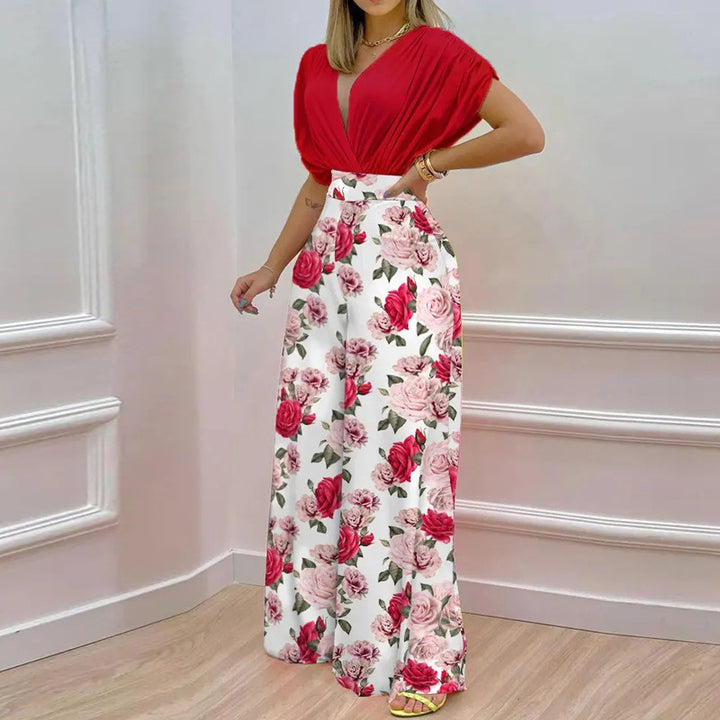 Kvinno Elegant Jumpsuit med Djup V-Hals och Bred Klipp Ben Mirla-Eva Jonsson