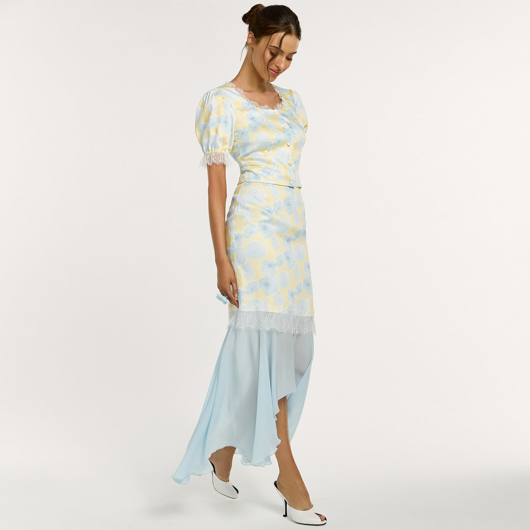 Kvinno elegant klänning med asymmetrisk nederkant och blommönster Mirla-Eva Jonsson