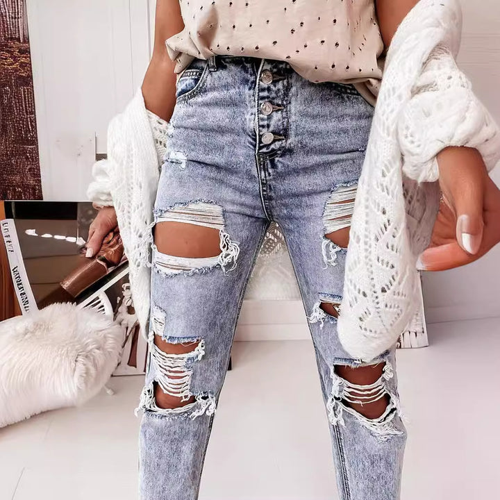 Kvinno förstörda jeans i avslappnad pojkvänsmodell med hög midja och detaljer Mirla-Eva Jonsson