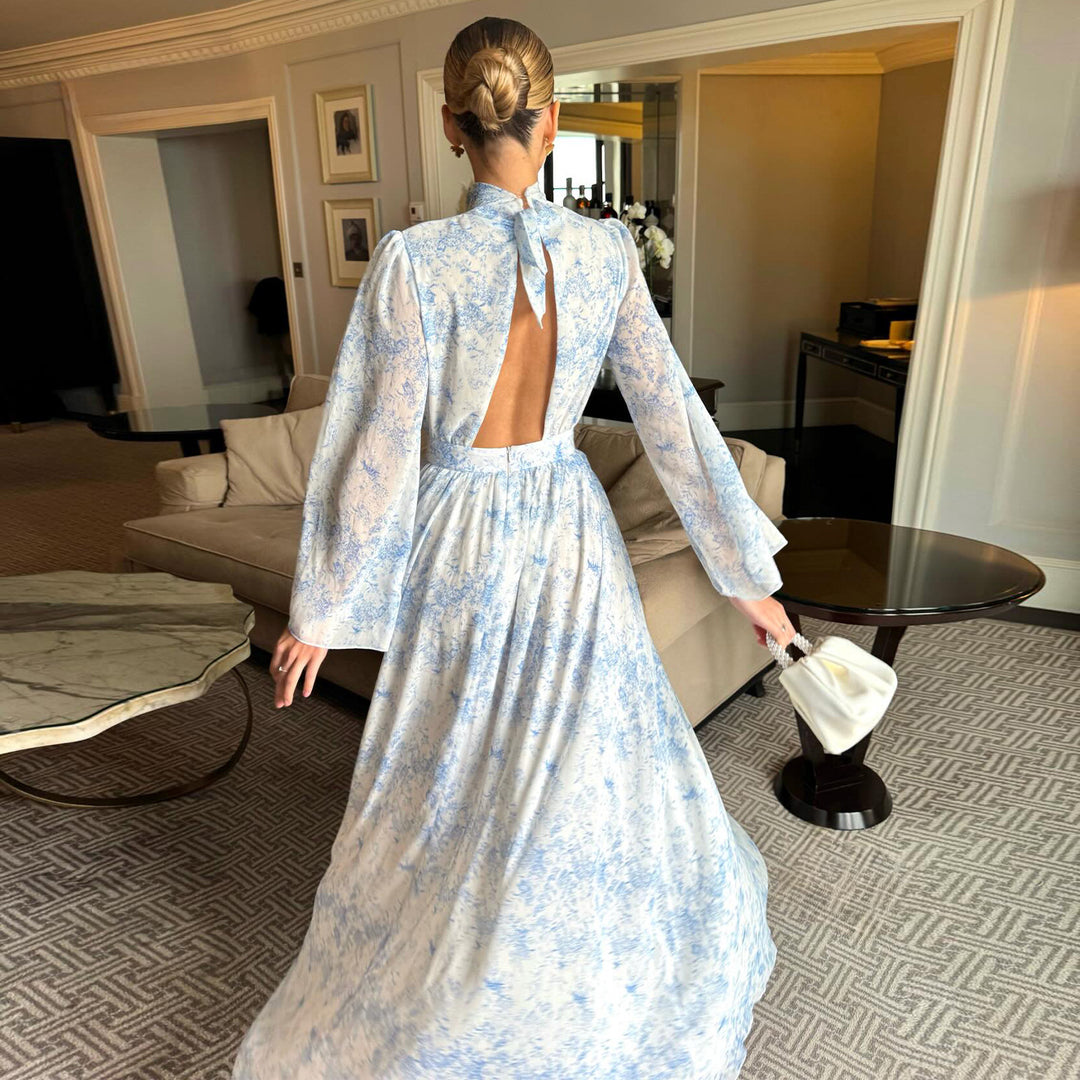 Kvinno maxi klänning med transparenta ärmar och elegant blomstermönster Mirla-Eva Jonsson