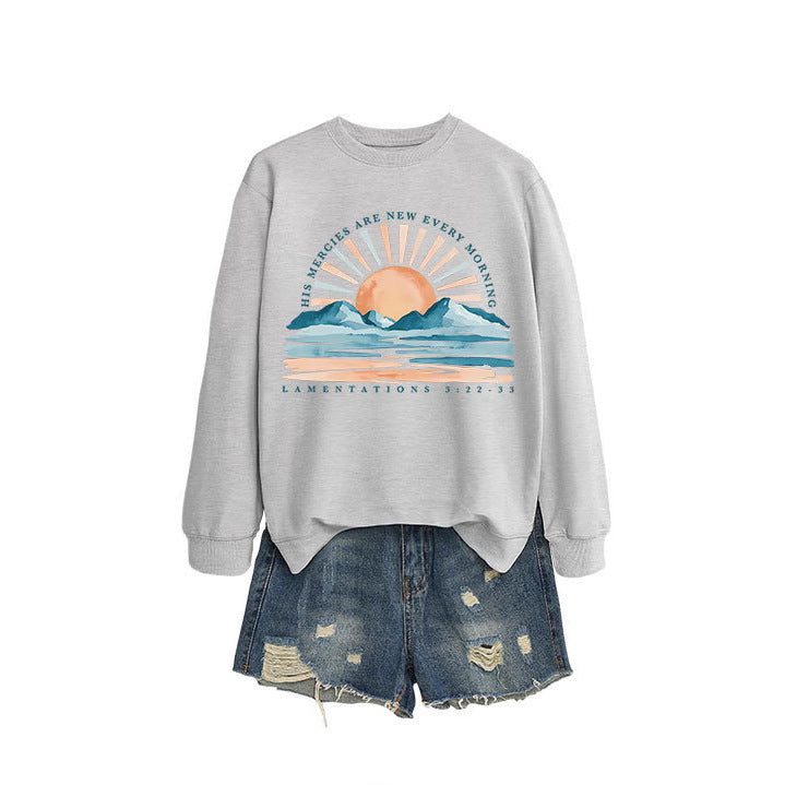 Kvinno sweatshirt med inspirerande soluppgångsdesign och avslappnad passform Mirla-Eva Jonsson