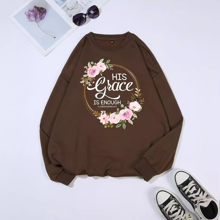 Kvinno sweatshirt med motiverande text och blommönster Mirla-Eva Jonsson