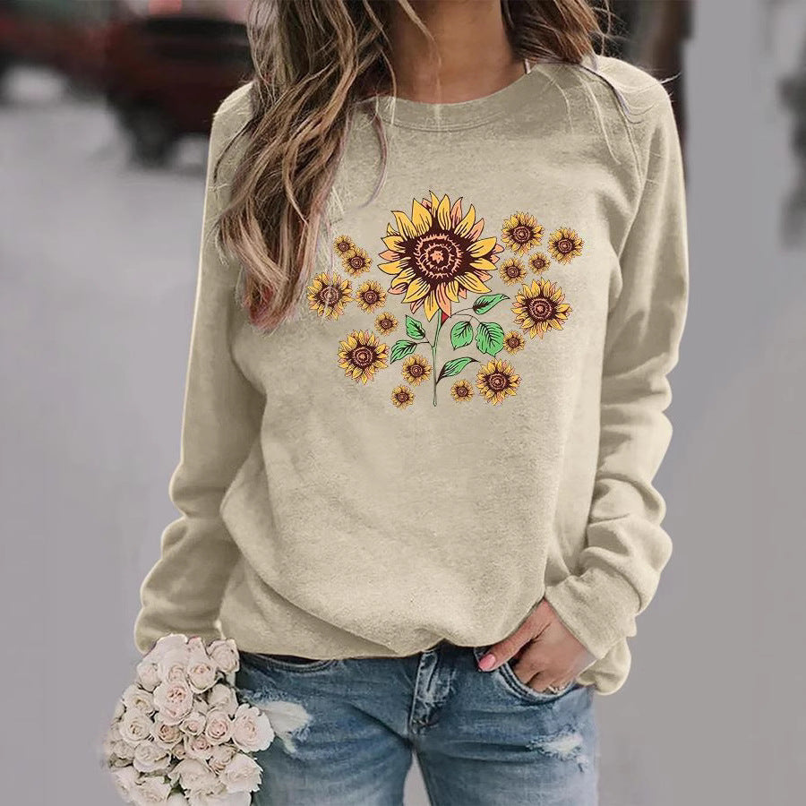 Kvinnohoodie med blommigt solrosmotiv och bekväm passform Mirla-Eva Jonsson