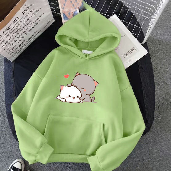 Kvinnohoodie med lekfull kattmotiv och bekväm passform Mirla-Eva Jonsson