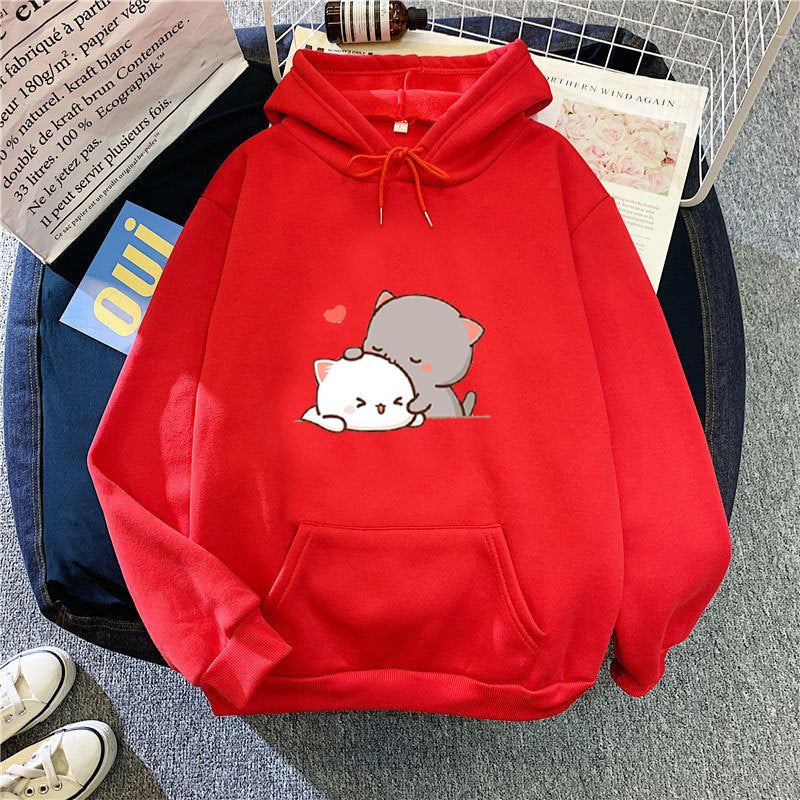 Kvinnohoodie med lekfull kattmotiv och bekväm passform Mirla-Eva Jonsson
