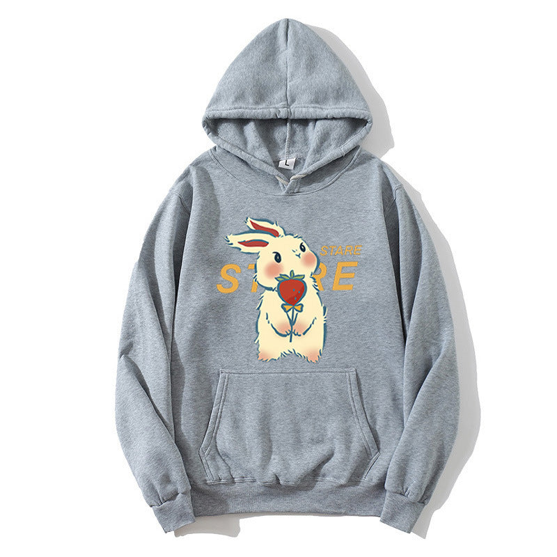 Kvinnohoodie med lekfullt kaninmotiv och inspirerande slogan Mirla-Eva Jonsson