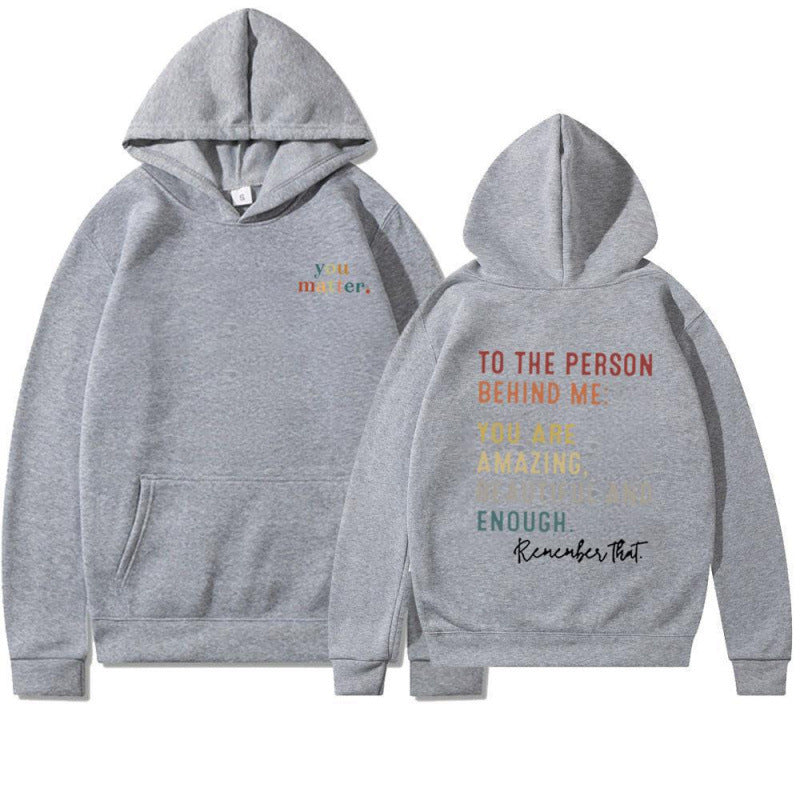 Kvinnohoodie med motiverande text Mirla-Eva Jonsson