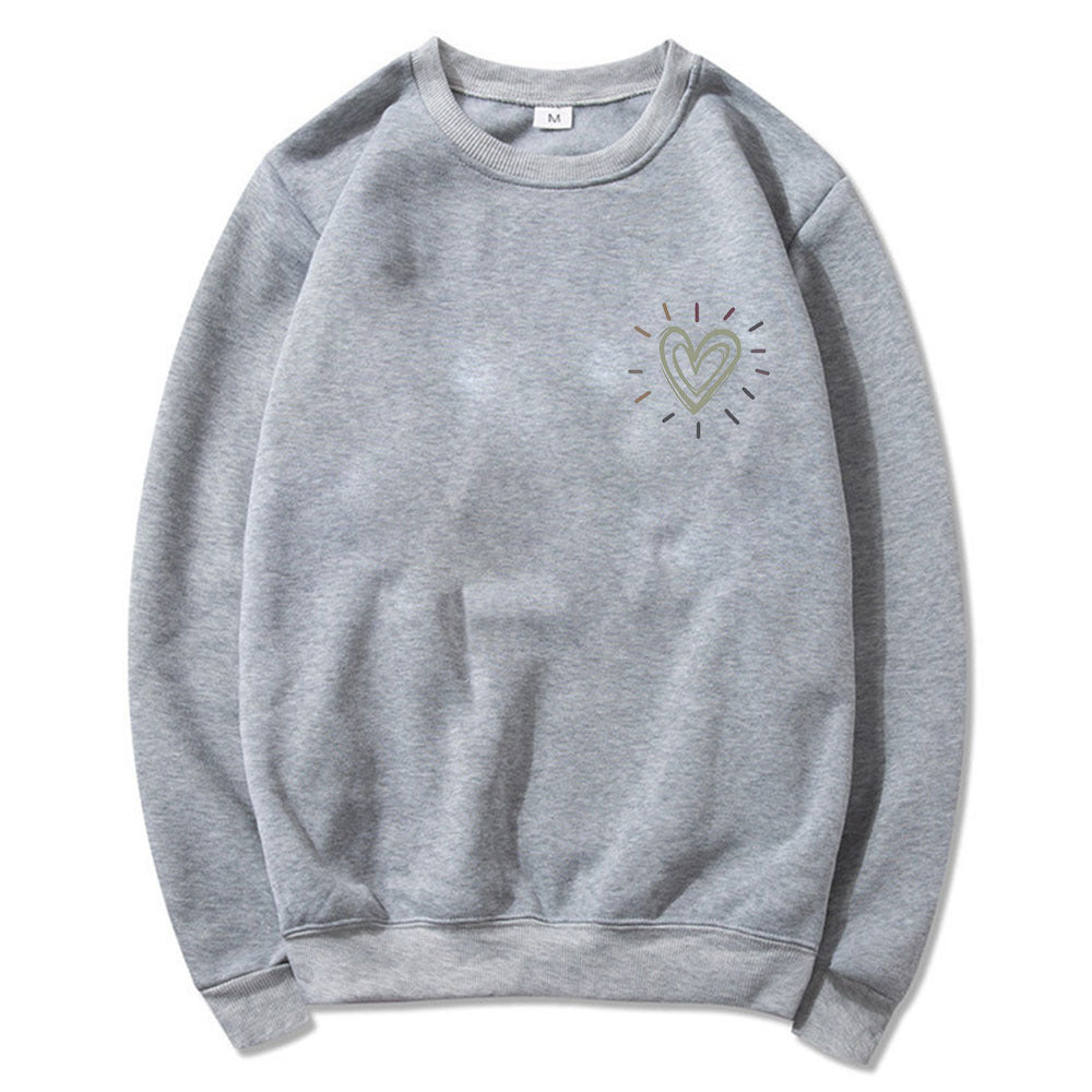 Kvinnooversized sweatshirt med sött hjärtmotiv och avslappnad skärning Mirla-Eva Jonsson