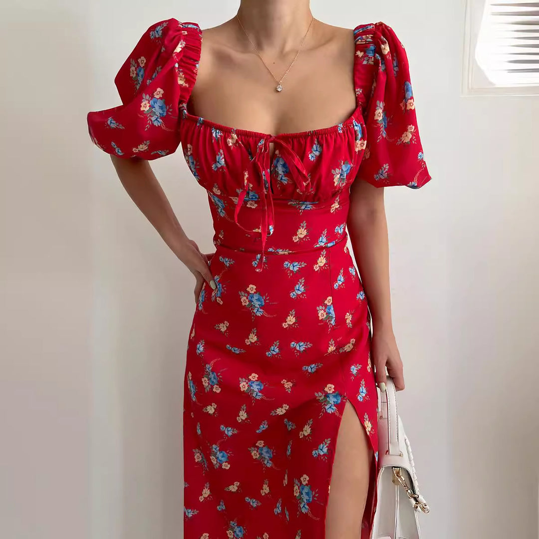 Kvinnor Blommönster Maxi Klänning med Puffärmar och Hög Slits Mirla-Eva Jonsson