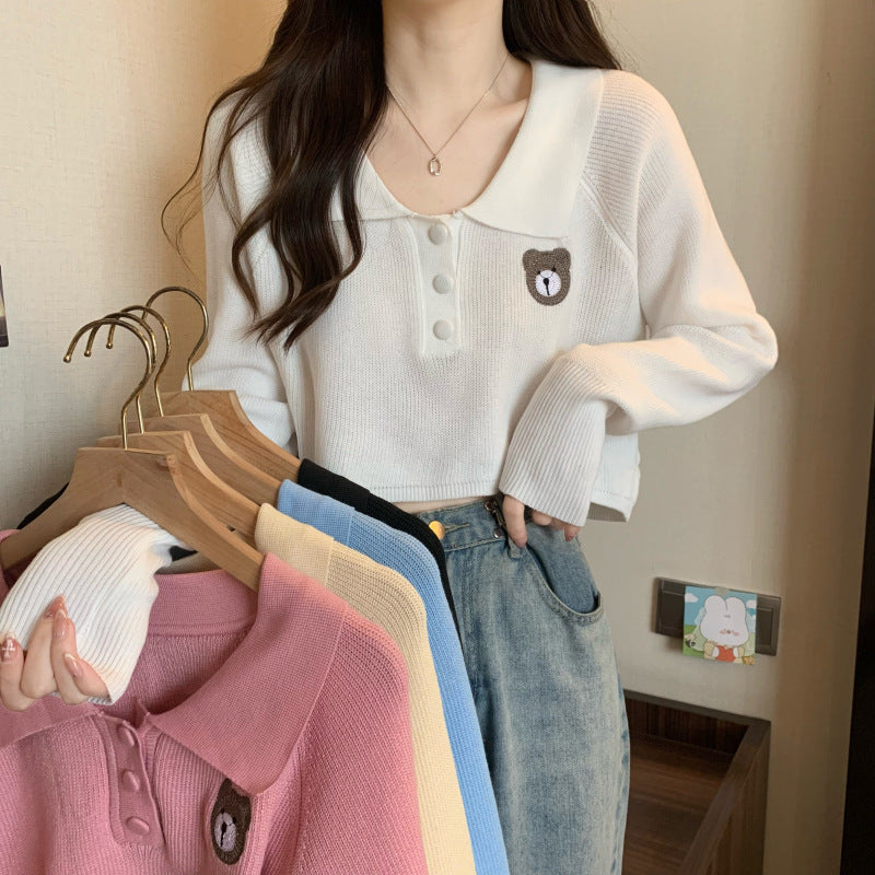 Kvinnor Cropped Pullover med en knappstängning och enhörningsemblem-Eva Jonsson