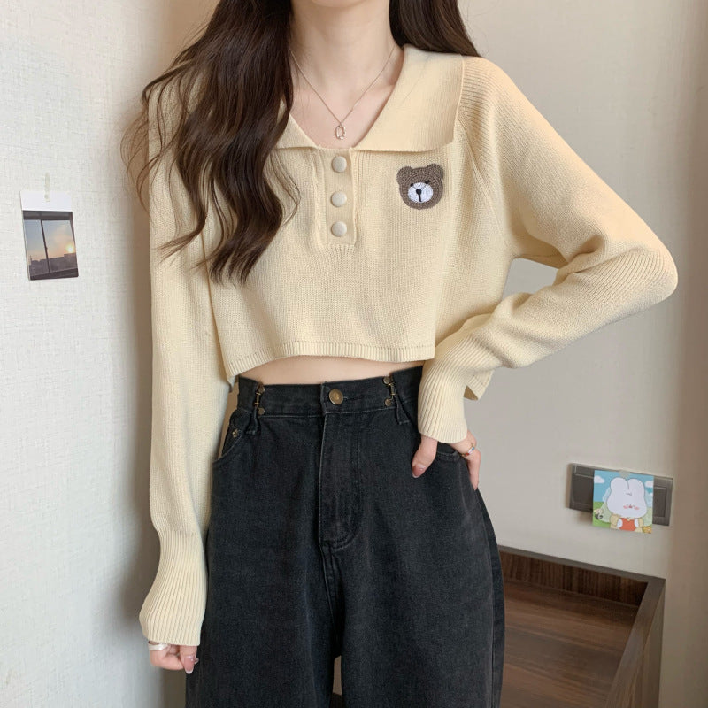 Kvinnor Cropped Pullover med en knappstängning och enhörningsemblem-Eva Jonsson