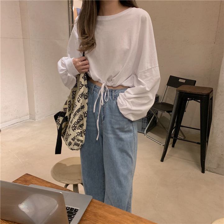 Kvinnor Cropped Sweatshirt med innovativ dragsko och oversized ärmar Mirla-Eva Jonsson