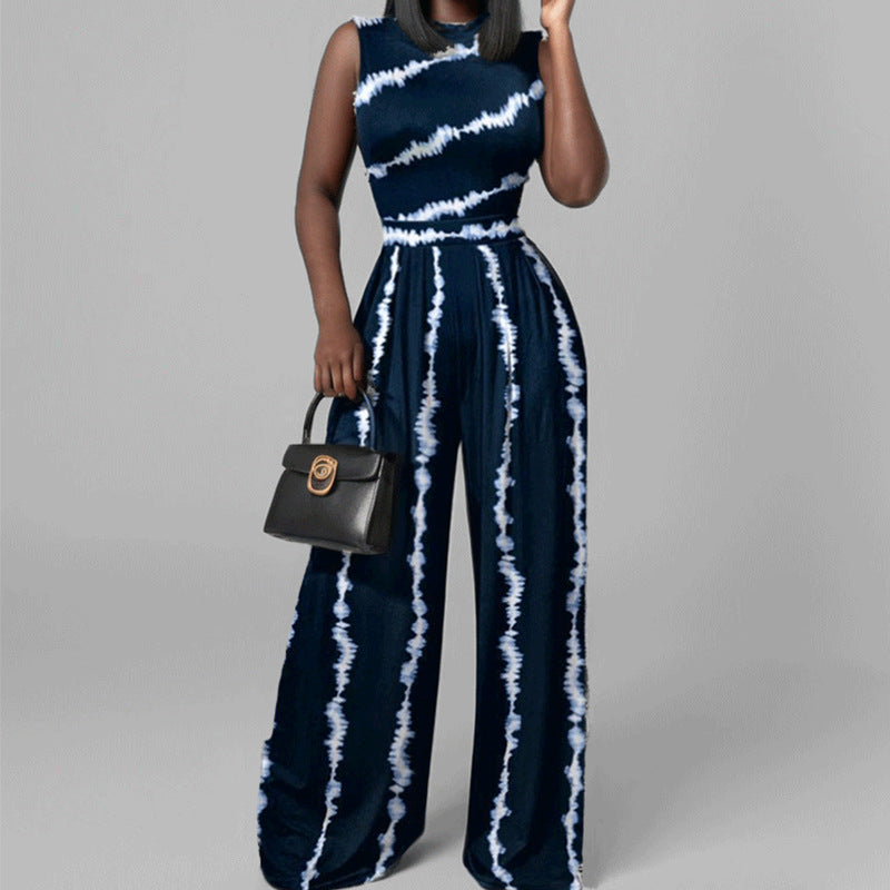 Kvinnor Elegant Jumpsuit med Bred Ben och Blommönster Mirla-Eva Jonsson