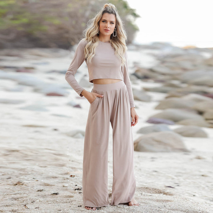 Kvinnor Elegant Jumpsuit med Vid Ben och Långa Ärmar Mirla-Eva Jonsson